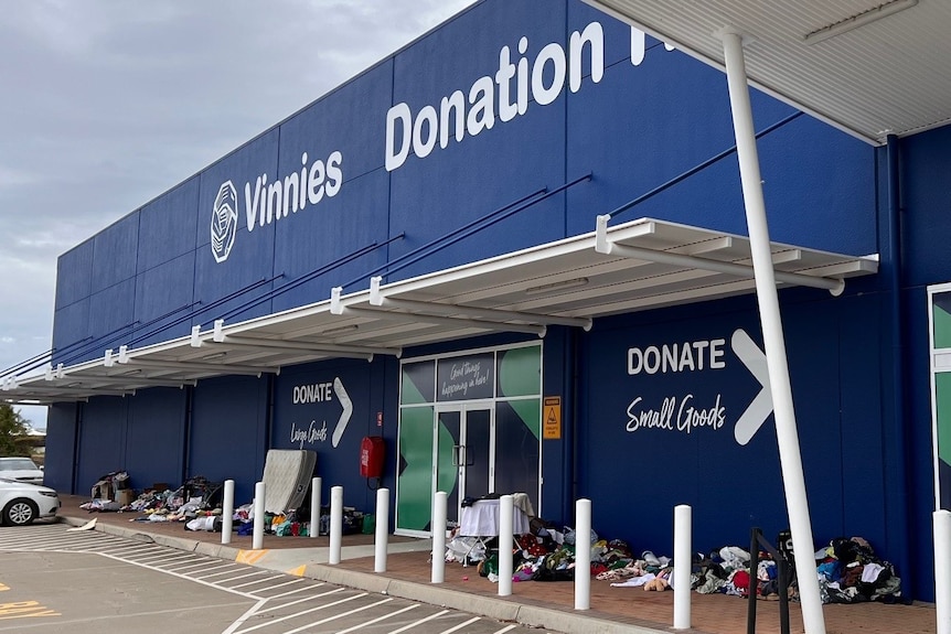 Dumped donations line the outside of a charity store in Townsville. 