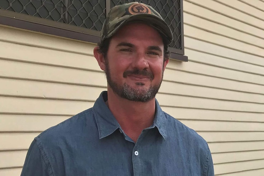 A Bundaberg farmer outside a community hall