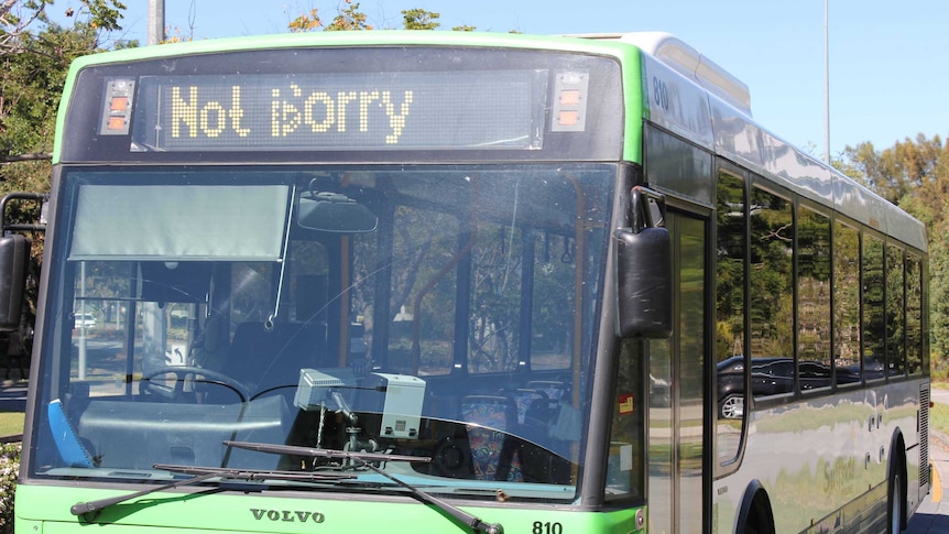 A bus shows the words "Not sorry" on its LED display.