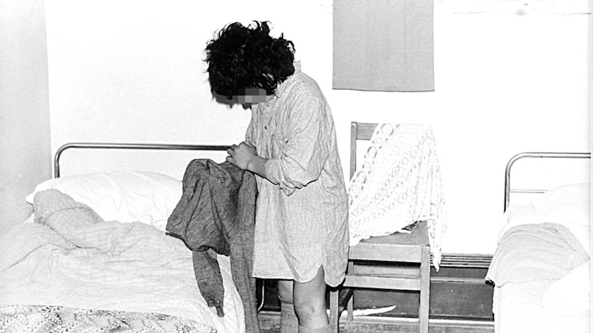 A photo of an unidentifiable student next to a bed at Marylands, St John of God school in Christchurch.