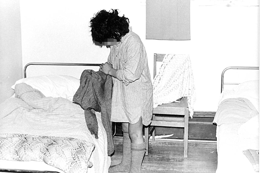 A photo of an unidentifiable student next to a bed at Marylands, St John of God school in Christchurch.