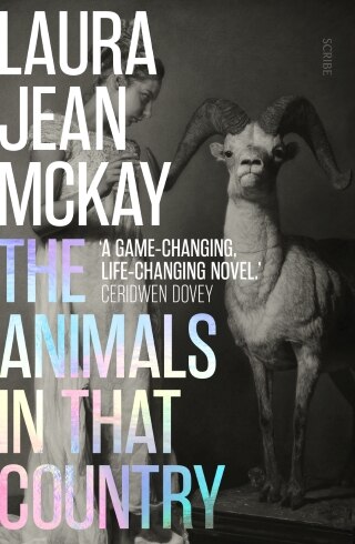 The book cover for The Animals in that Country by Laura Jean McKay with a woman and a goat