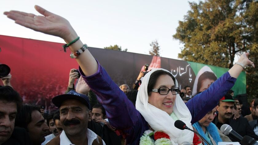 Former Pakistani prime minister Benazir Bhutto waves to her supporters