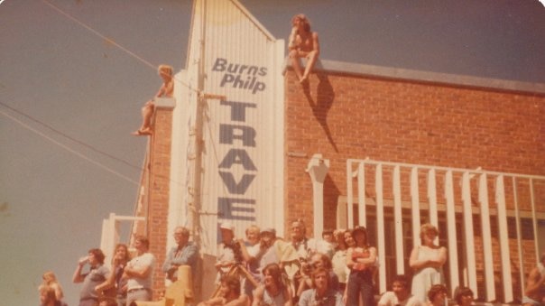 Crowd sitting on buildings during festival