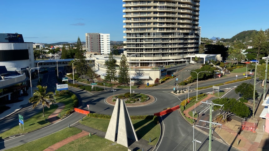 An aerial photo of an intersection that demarcates the border between NSW and Queensland.