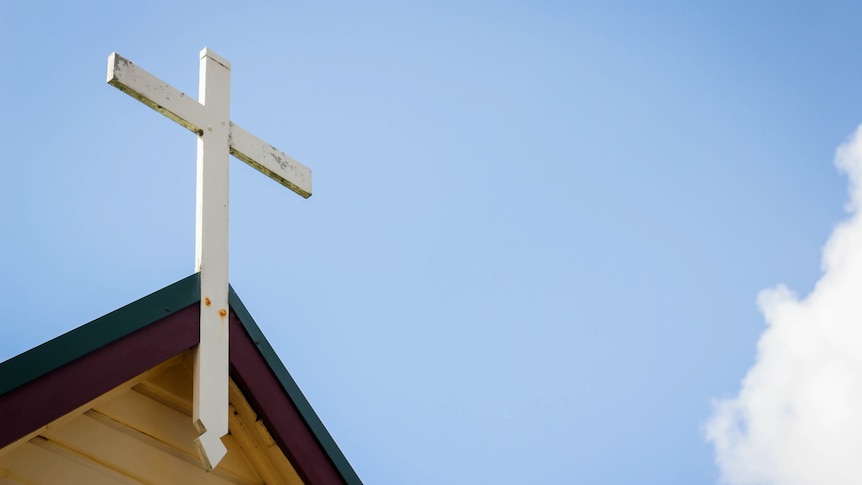 A cross on top of a church.