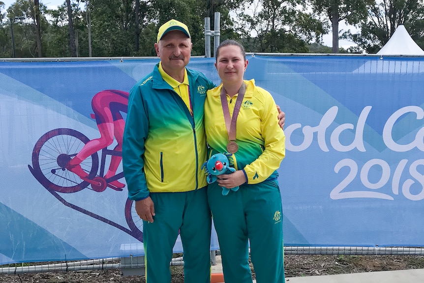 Elena Galiabovitch with her bronze medal around her neck, poses for a photo with her father Vlad.