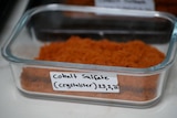 A container of cobalt sulfate.