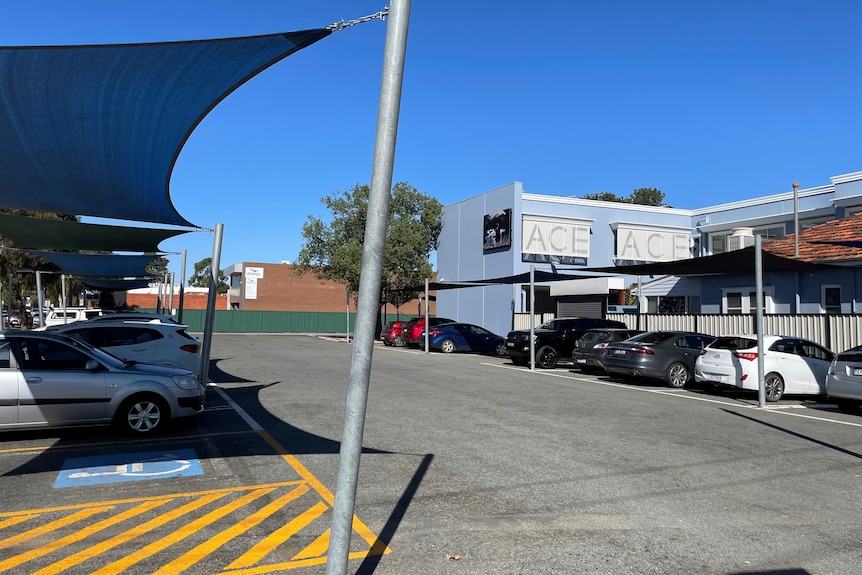 A car park filled with parked cars.