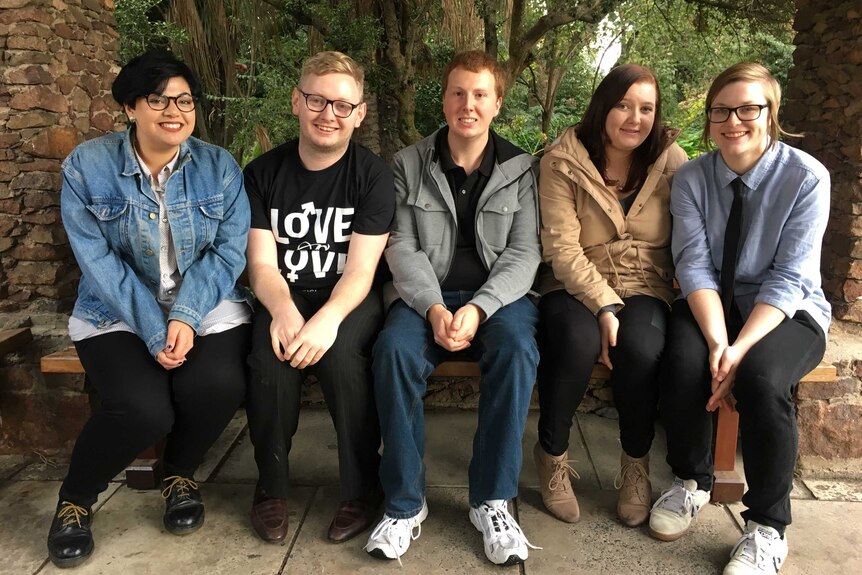 Victoria University students sitting on a bench