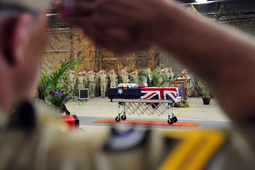 SAS soldiers salute the casket of their fallen comrade Sergeant Blaine Diddams, at RAAF Base Pearce, WA.