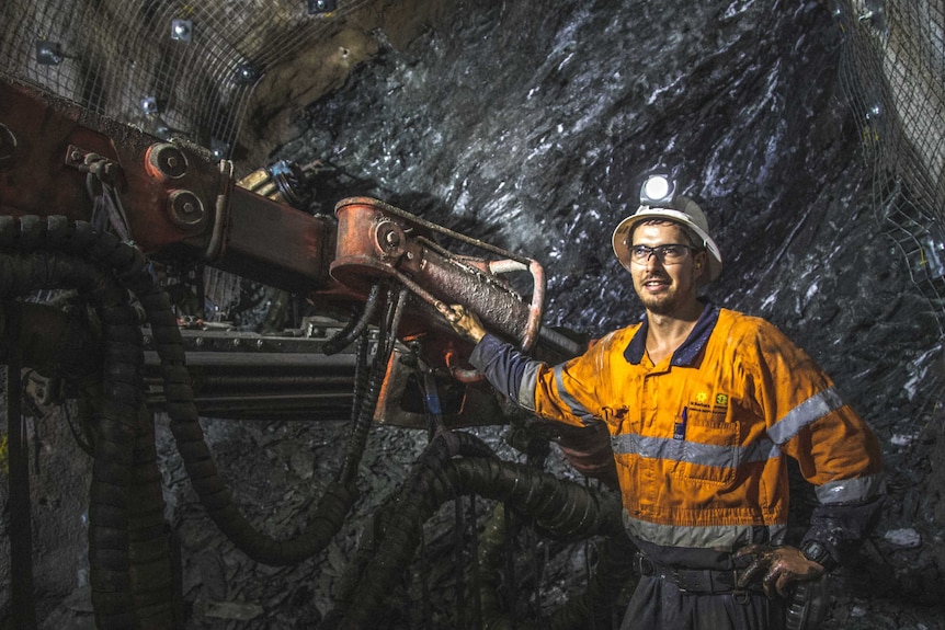 Mine worker in underground gold mine