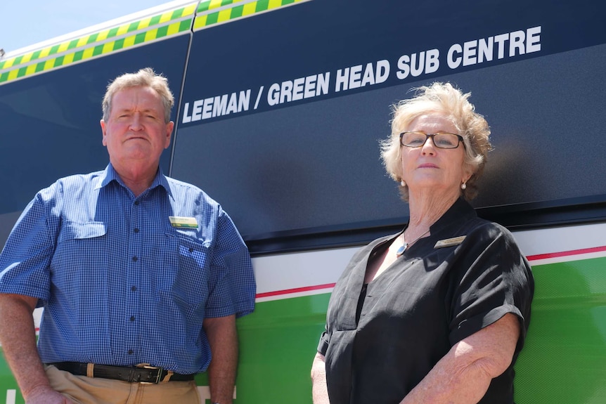 Shane Love and Moira Girando stand in front of the Leeman/Green Head ambulance.