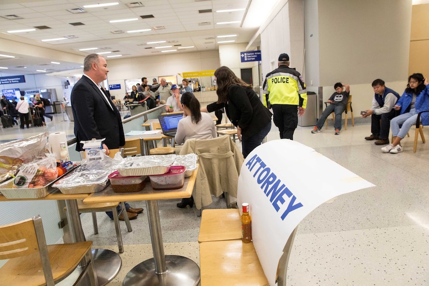 Lawyers set up in the arrivals area of Dallas Fort Worth International airport