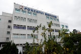 Foxconn building is shown, with logo in view. 