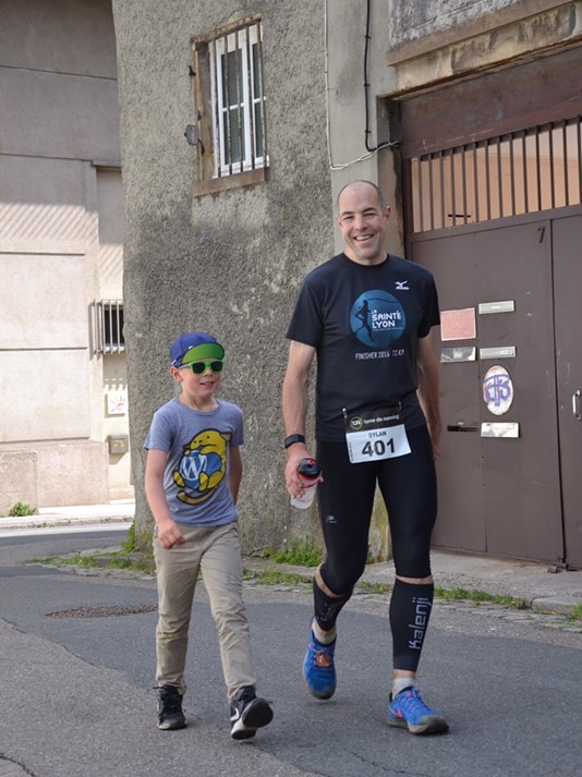 Dylan Kissane with his son Jamie walking along the street