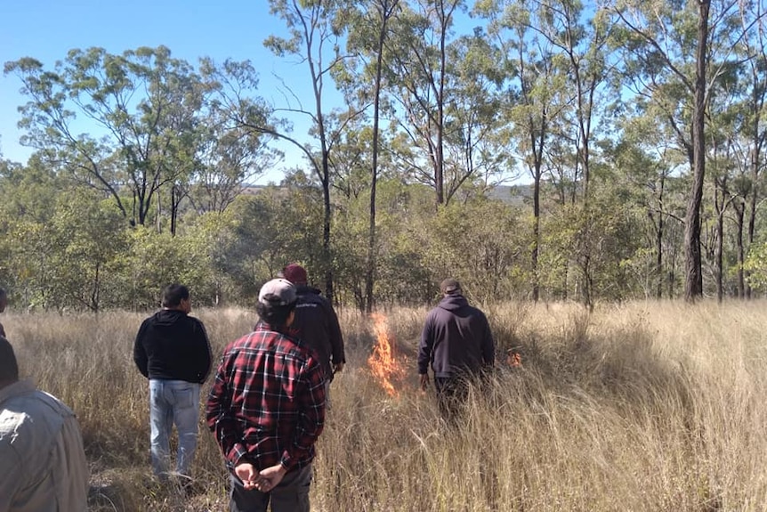 Community elders instruct Silver Lining students how to conduct burn-offs to protect against future bushfires.