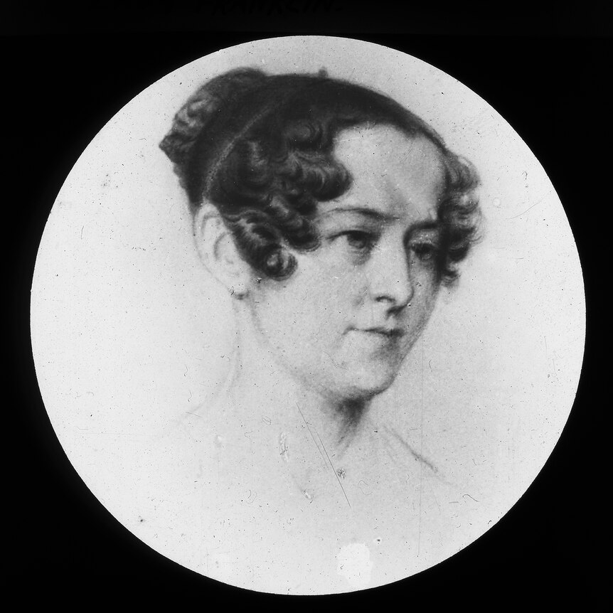 a black and white drawing of a woman with dark hair from the 1830s
