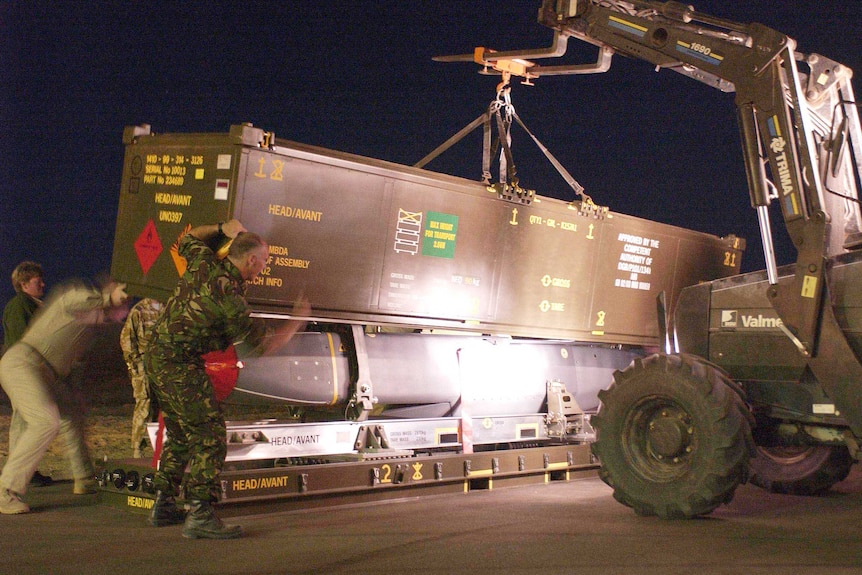 A storm shadow missile is prepared for loading to a Royal Air Force Tornado GR4 aircraft.