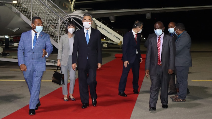 Solomon Islands Foreign Minister Jeremiah Manele welcomes his Chinese counterpart Wang Yi at the airport