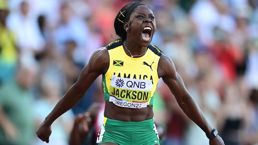 A fermale jamaican sprint celebrates winning gold at the world athletics championships.