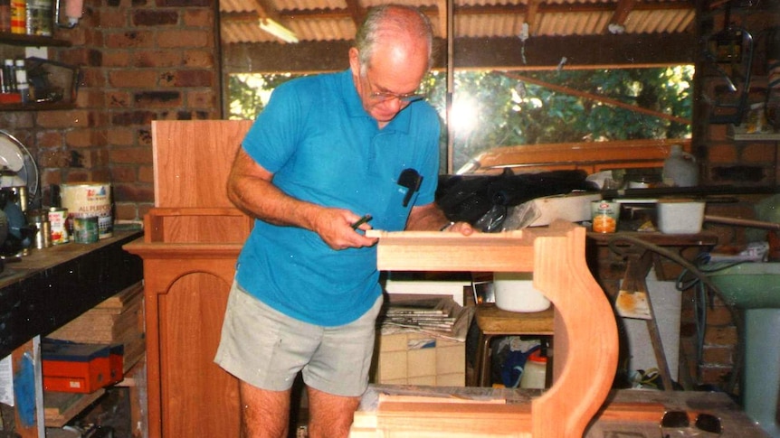 John building in his workshop.