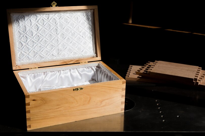 A completed baby box with white lining.