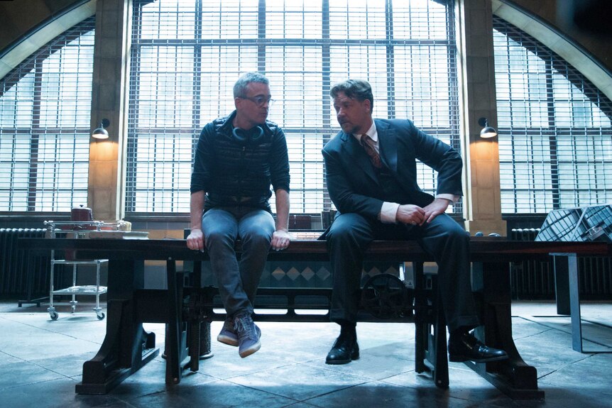 Alex Kurtzman and Russell Crowe sit and talk on the set of The Mummy movie.