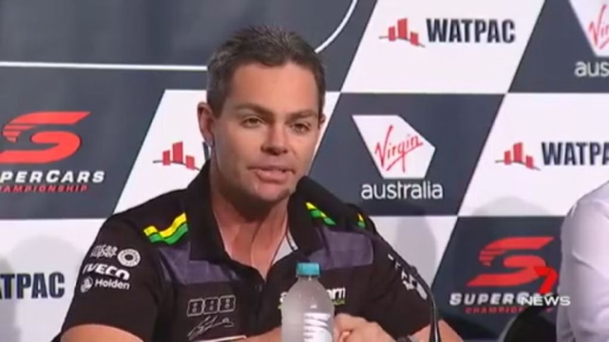 Craig Lowndes waves checkered flag on full-time racing
