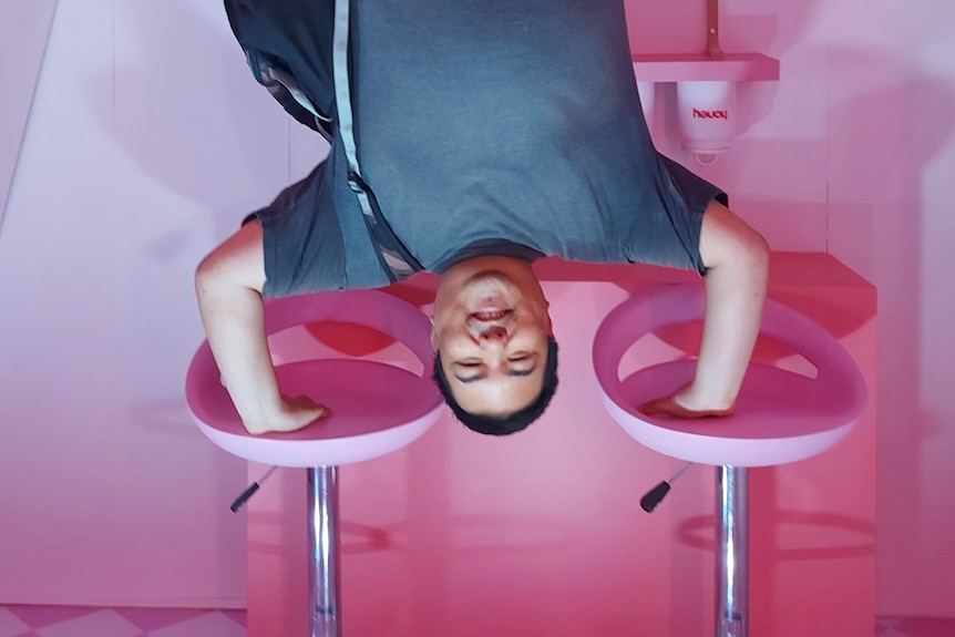 Vegan writer Marcus Ten Low creates an upside-down illusion in a fun house