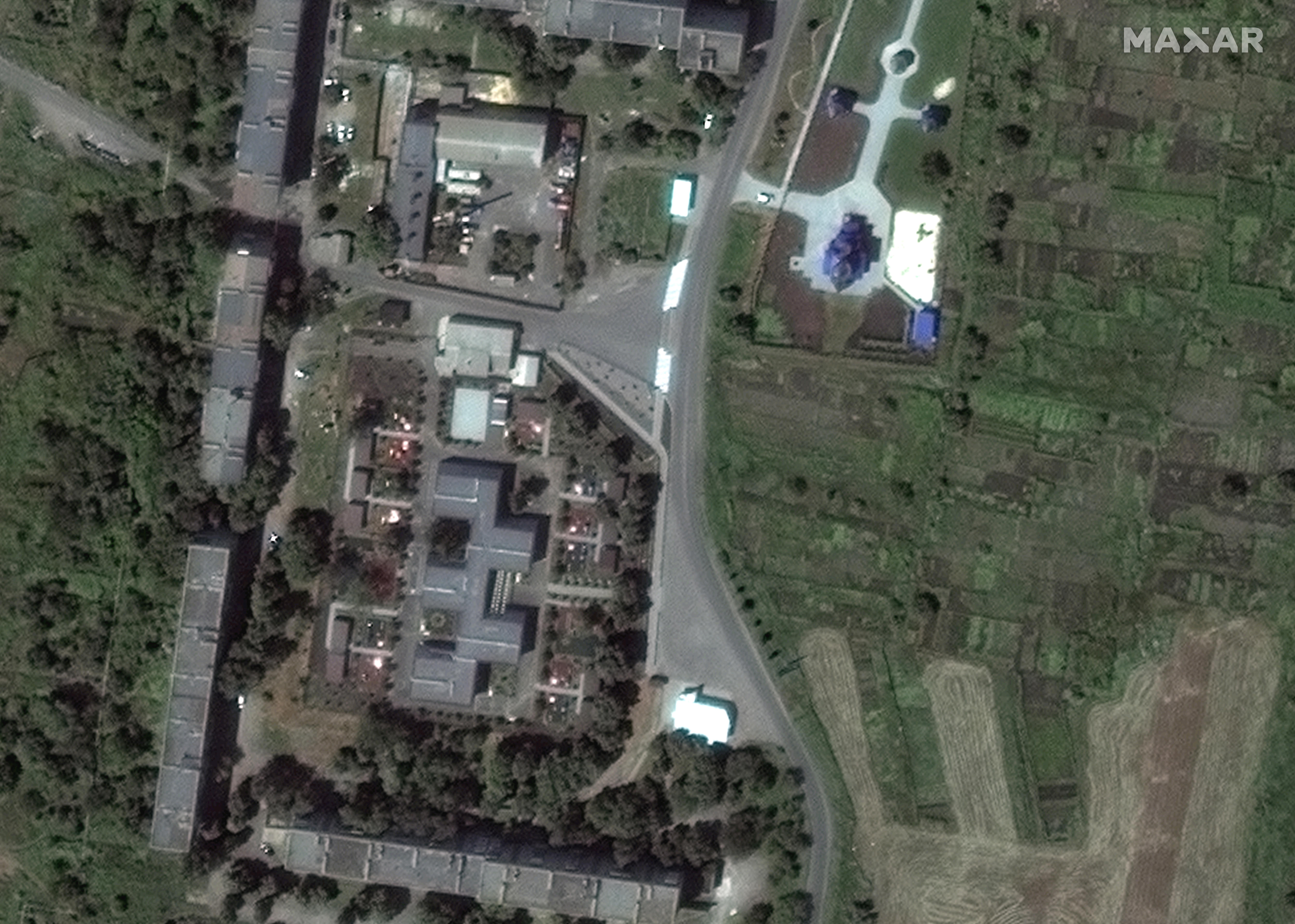Satellite image of Apartment complex and church.