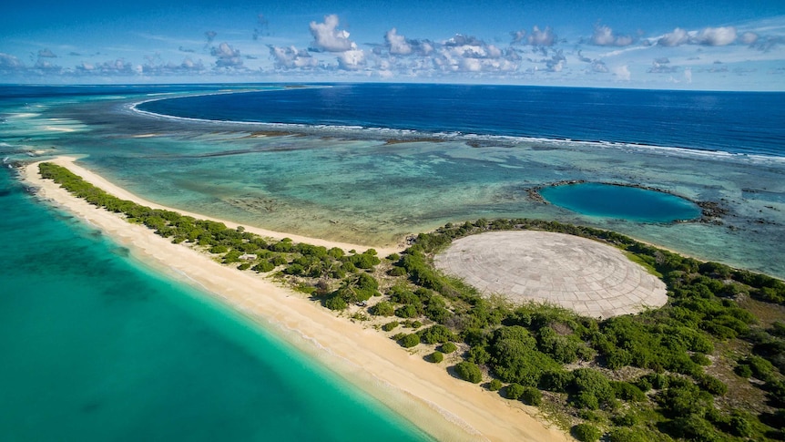 The dome on Runit Island with a crater left behind by another nuclear test.