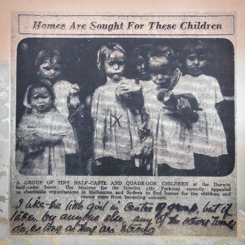 A clipping from a newspaper article shows a group of indigenous girls for rehoming.