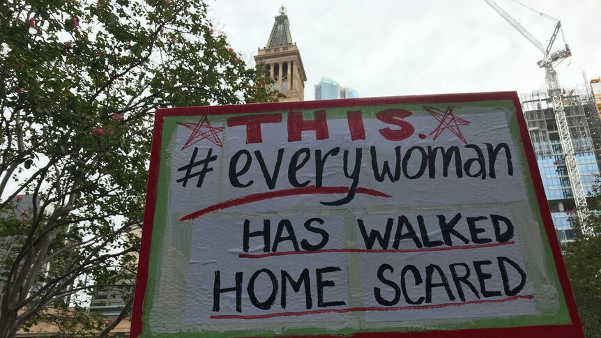 protest sign that reads THIS hastag every woman has walked home scared