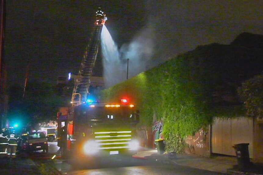 Firefighters battle a blaze at an abandoned warehouse in North Melbourne.