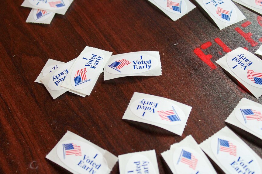 A table with 'I voted early' stickers