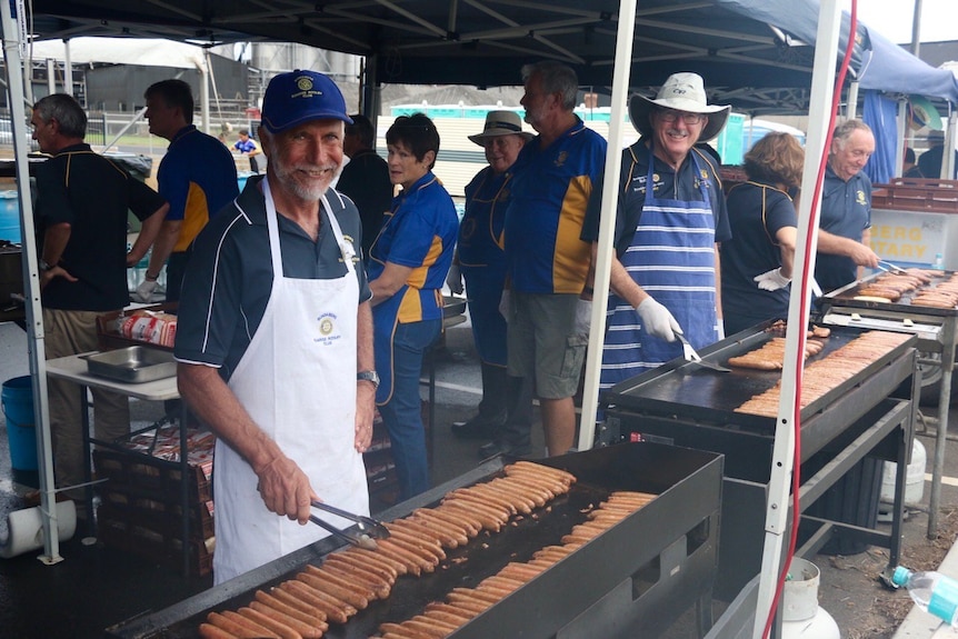 rotary volunteers cooking up sausages for the prince's visit to Bundaberg, 2018