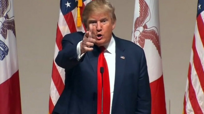 Donald Trump points his finger like a gun