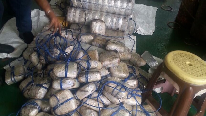 Indian authorities show some of the packages of heroin seized from a merchant ship.