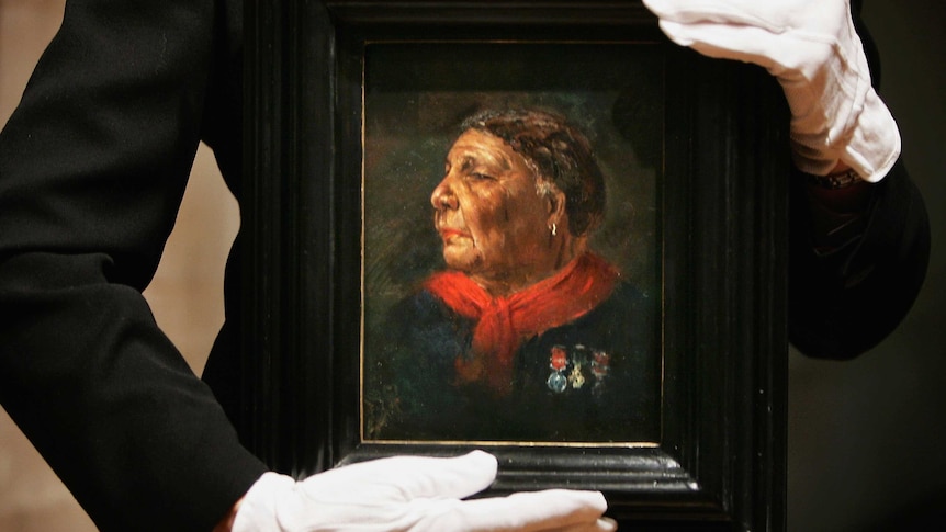 oil painting of older black woman, head and shoulders, strong and determined, the frame held by gloved white hands