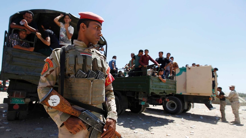 Iraqi soldier stands guard in Baghdad