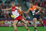 The Swans' Daniel Hannebery celebrates his goal in Sydney's 94-point win over the Giants.