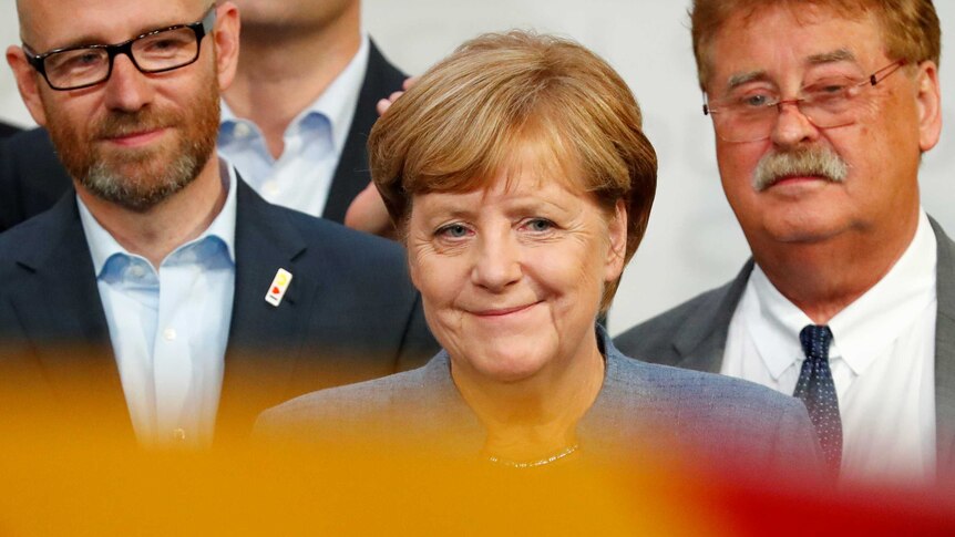 German Chancellor Angela Merkel reacts after winning the German general election.