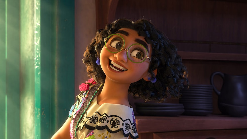 Animated brown girl with big glasses, curly dark hair, and cheery smile carries a stack of white plates to a kitchen table.