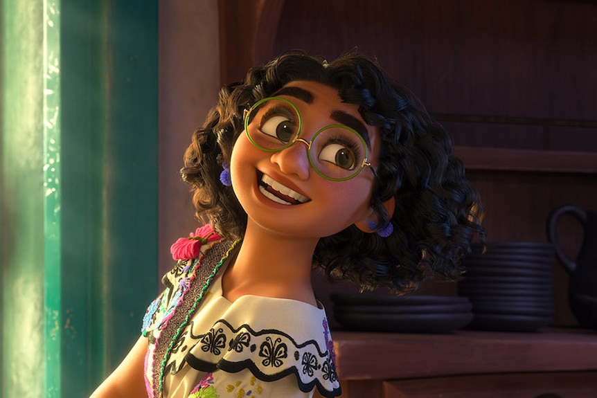 Animated brown girl with big glasses, curly dark hair, and cheery smile carries a stack of white plates to a kitchen table.