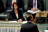 Julia Gillard listens to Tony Abbott