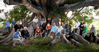 Kinchela Boys' Home survivors gathered under a fig tree.