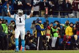Panthers quarter-back Cam Newton signals a touchdown
