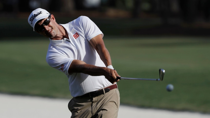 Adam Scott chips at the Players Championship