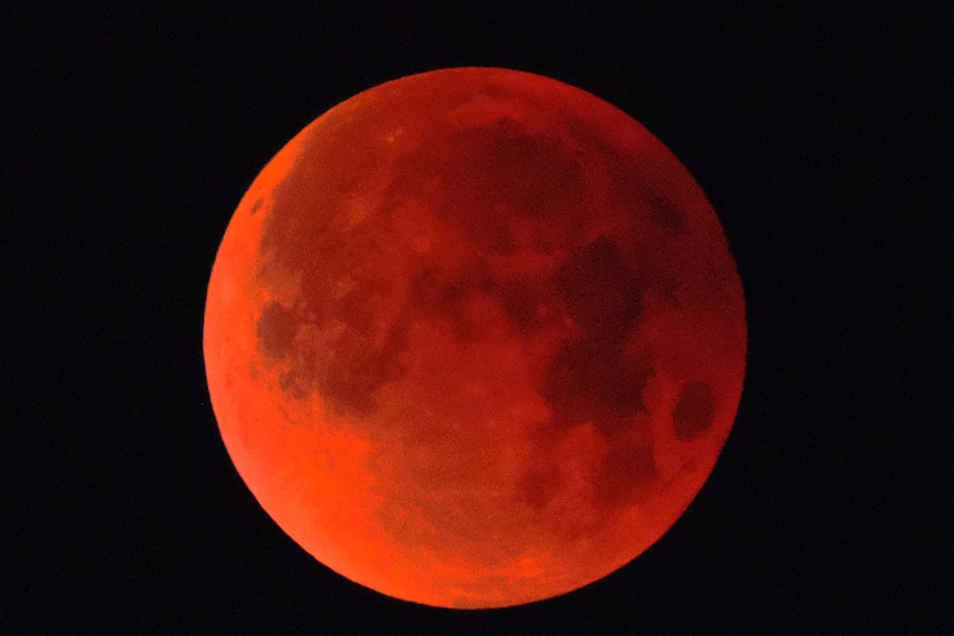 A super blue blood moon is seen over Los Angeles.